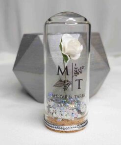 Fleur en Fiole avec Paillettes Argentées